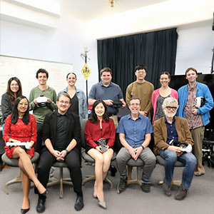 Project leads and researchers from the Center for Advanced Computer-Human Ecosystems (CACHE) gather to celebrate receiving the Georgia Clinical and Translational Science Alliance Presidents' Award of Distinction. Grace Ahn, CACHE founding director (center, front row), holds the award on her lap.